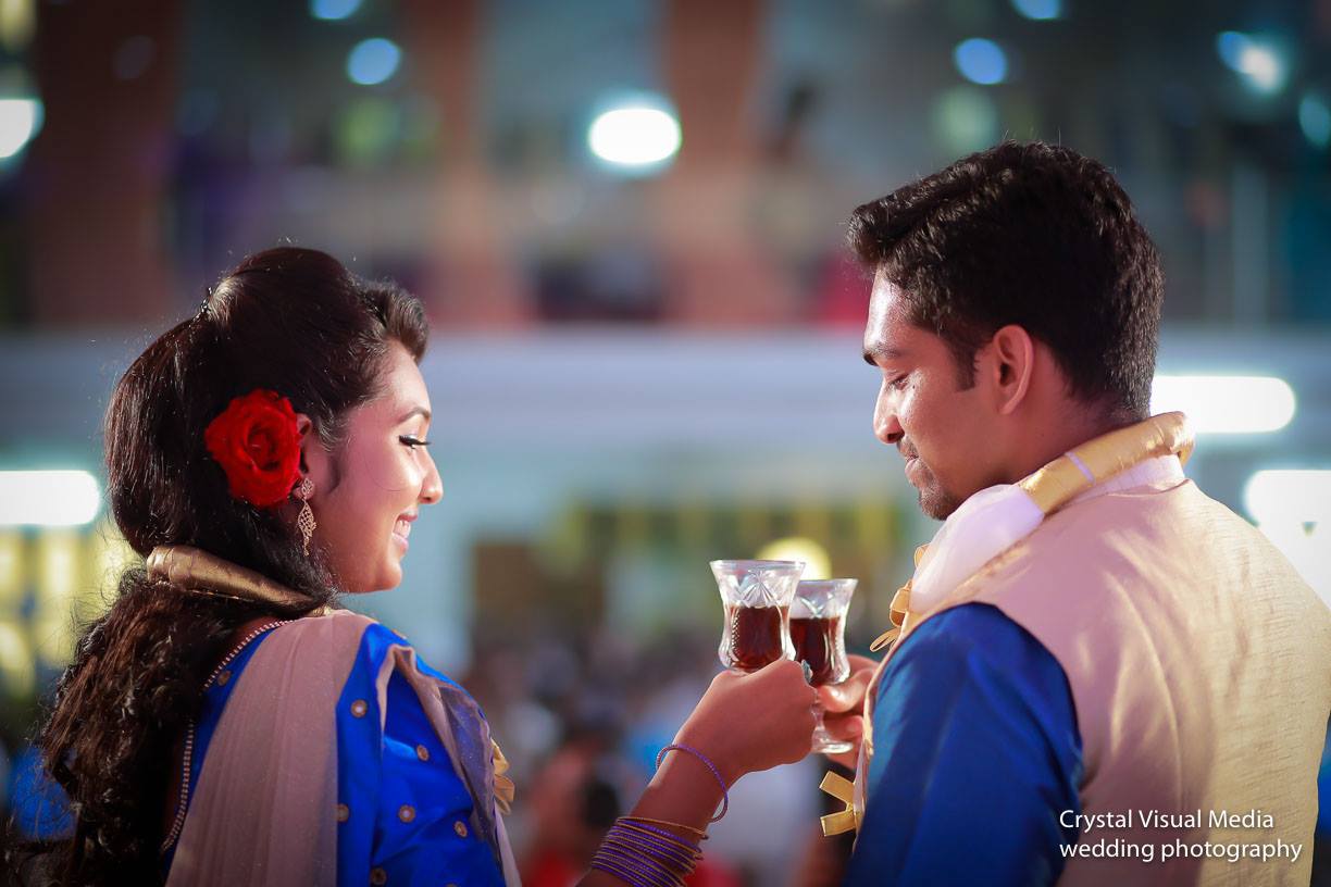A candid shot capturing the vibrant atmosphere of the Christian engagement ceremony in Kochi.