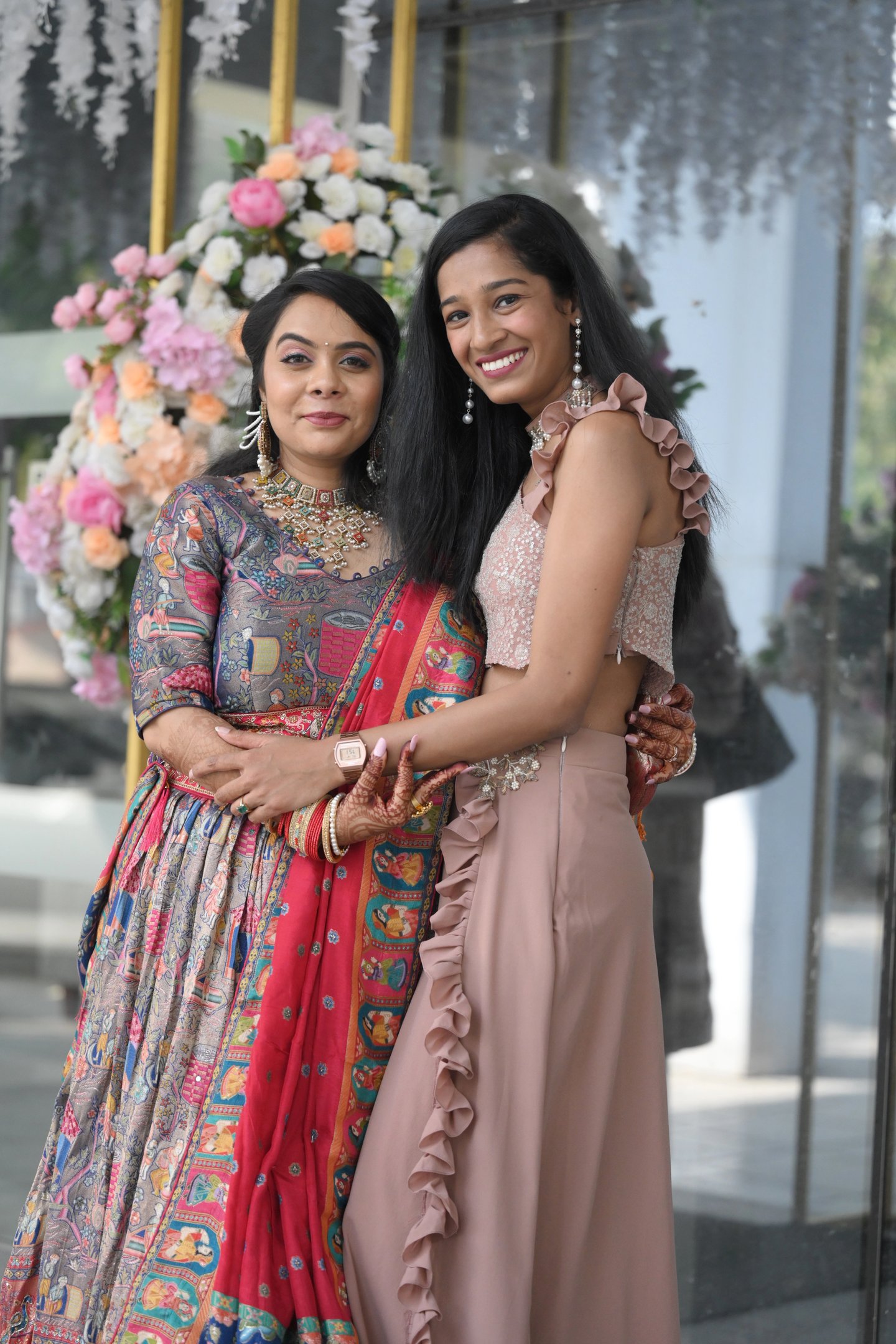 The couple, Anuradha and Aranya, posing for a beautiful wedding portrait.
