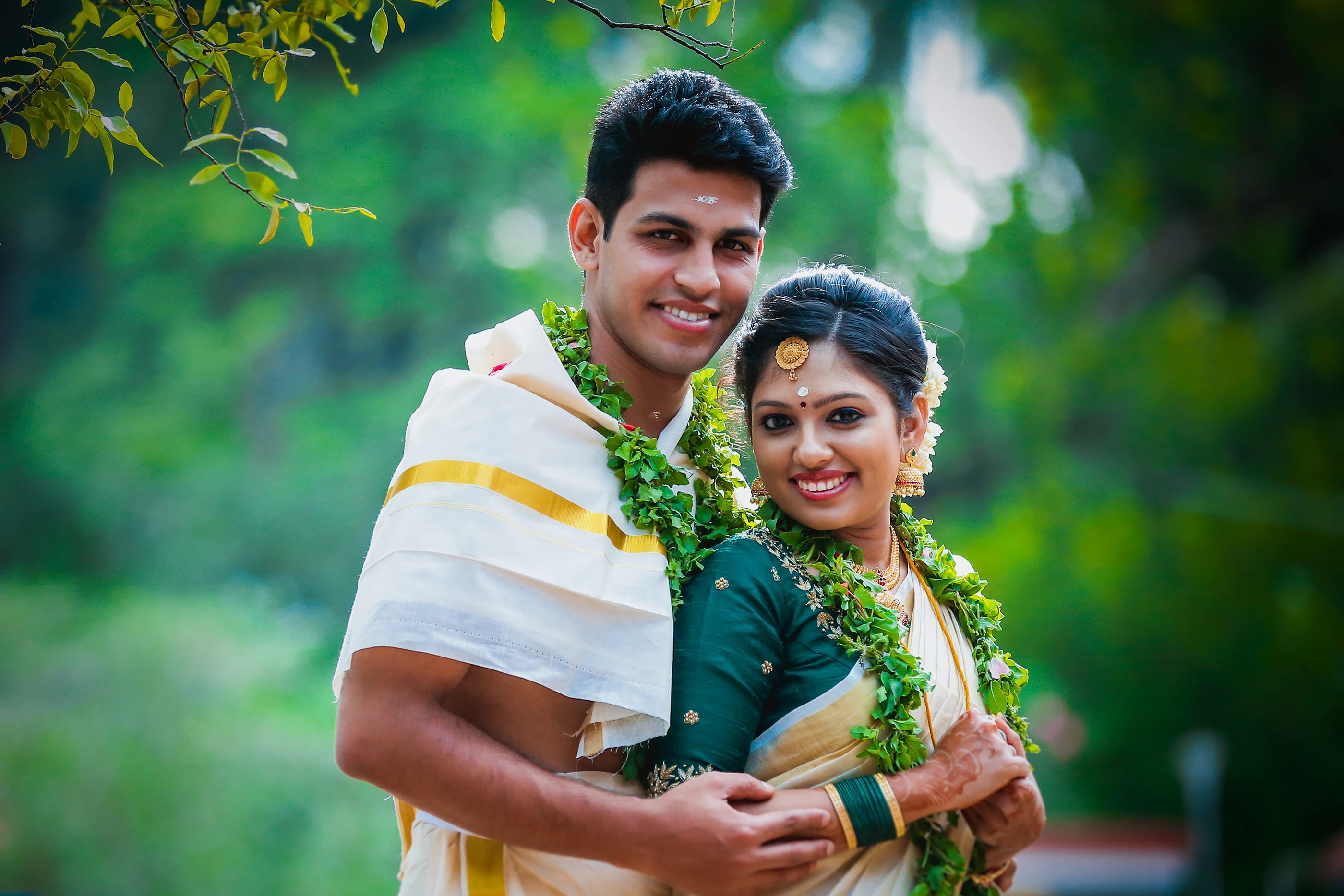 Candid wedding photography in Kasaragod: A beautiful bride in traditional attire during her ceremony.