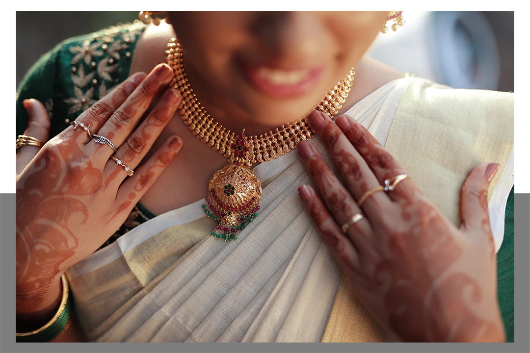 A heartfelt glance between the bride and groom, Ananya and Arjun, at their Kasaragod wedding.