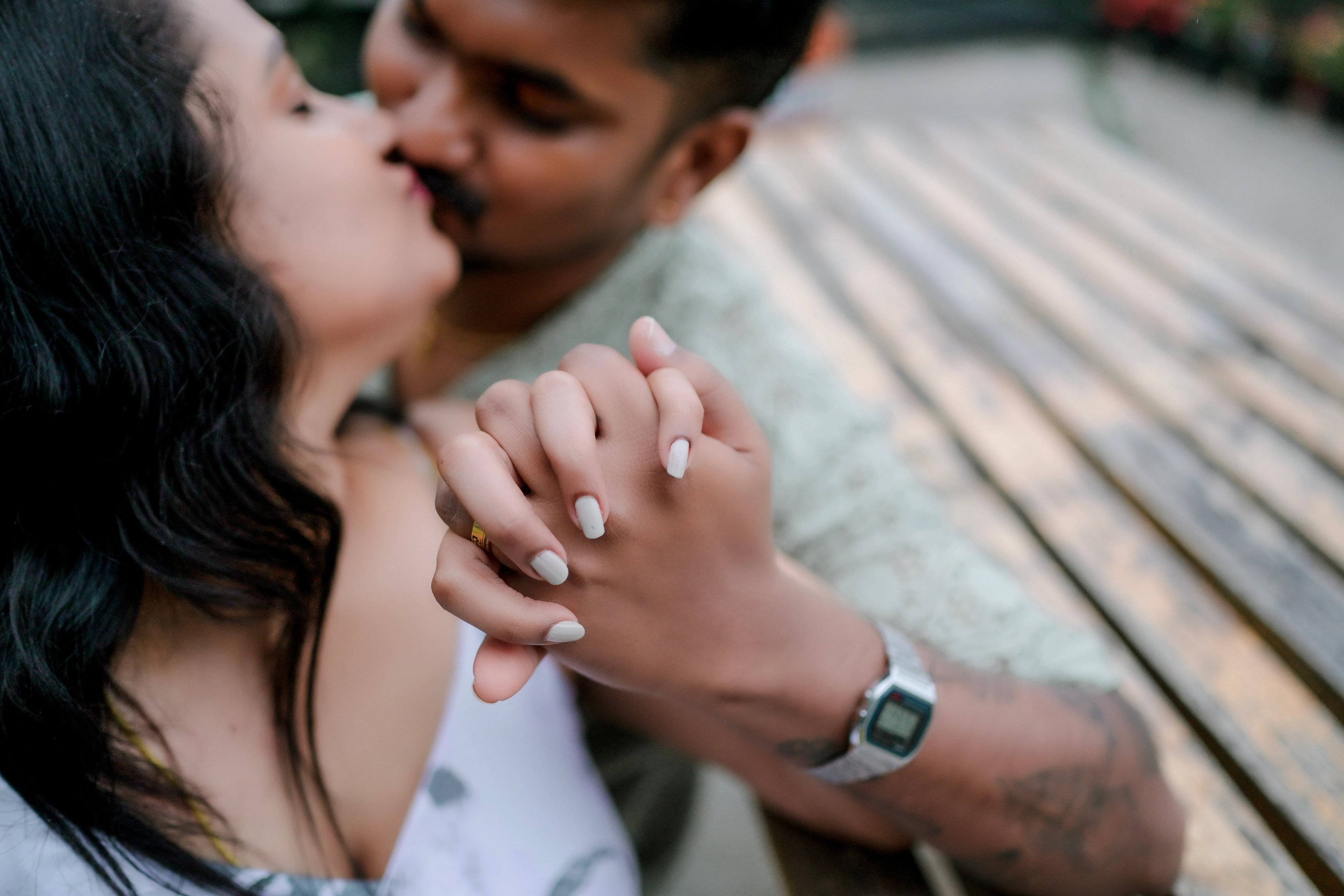 The couple walking hand-in-hand through the lush tea plantations of Ooty.