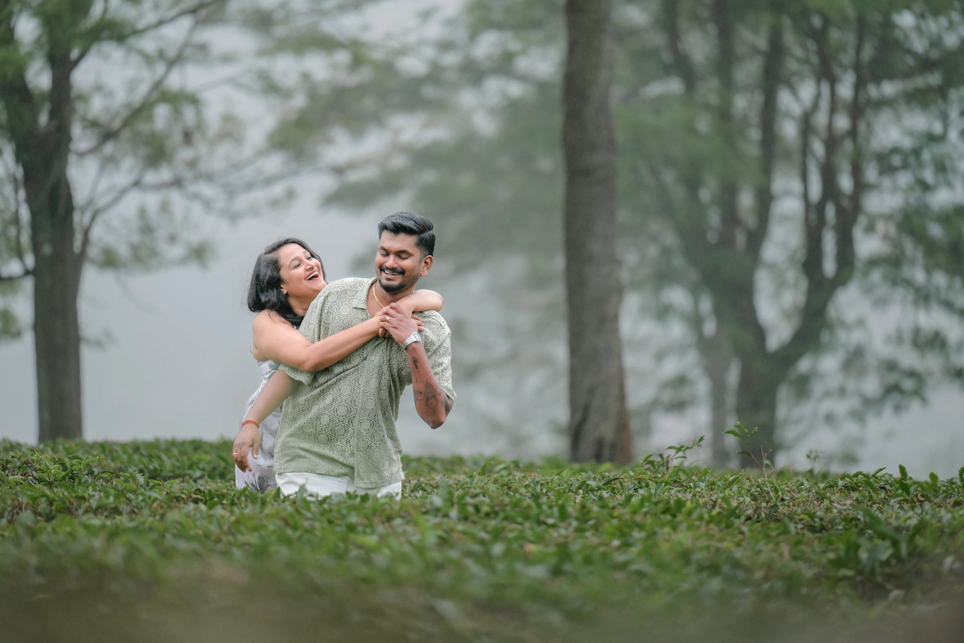 An intimate portrait of Sruthi and Sridharan during their rainy Ooty pre-wedding shoot.