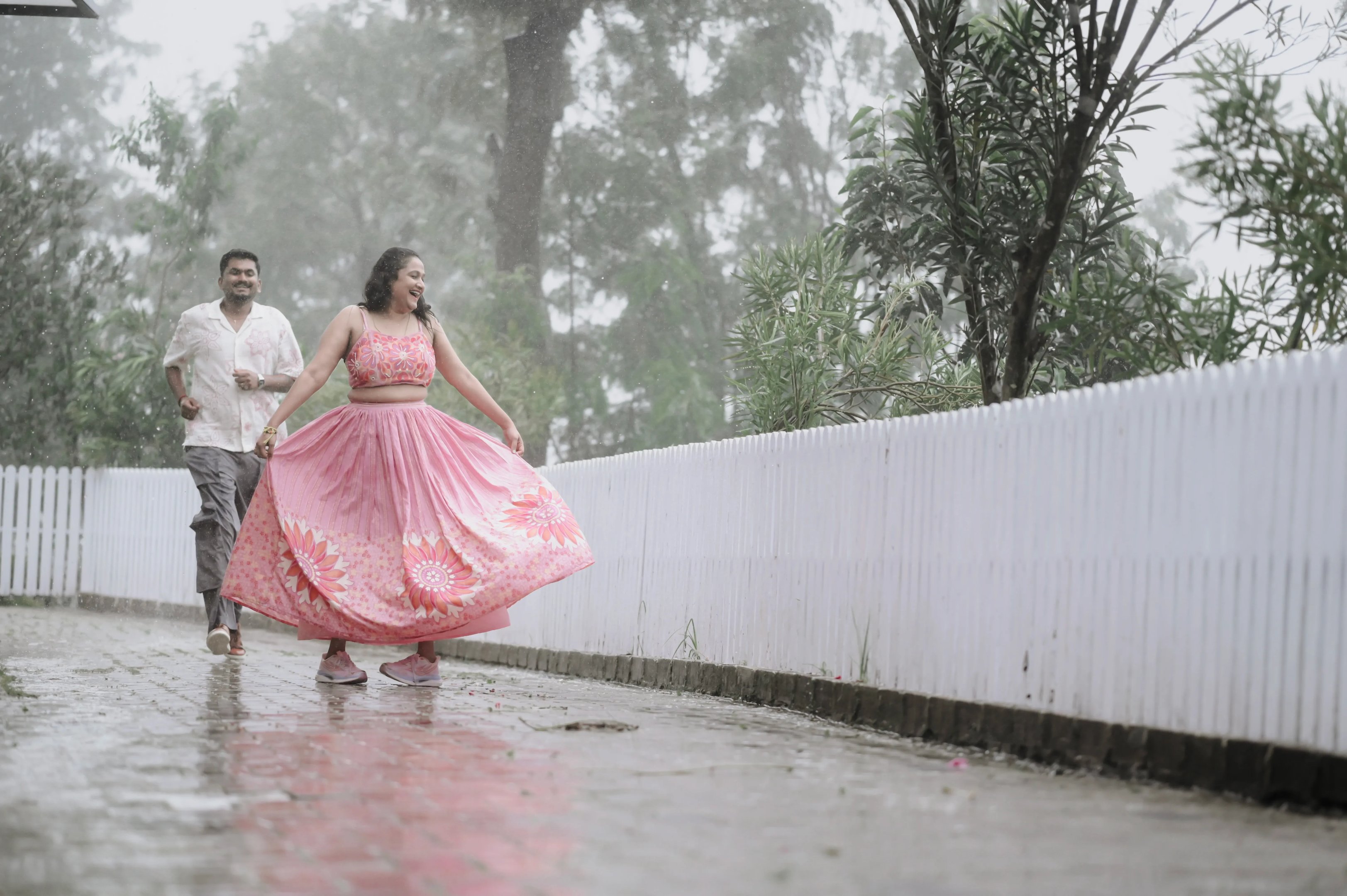 The couple framed by the natural beauty of Ooty's flora.