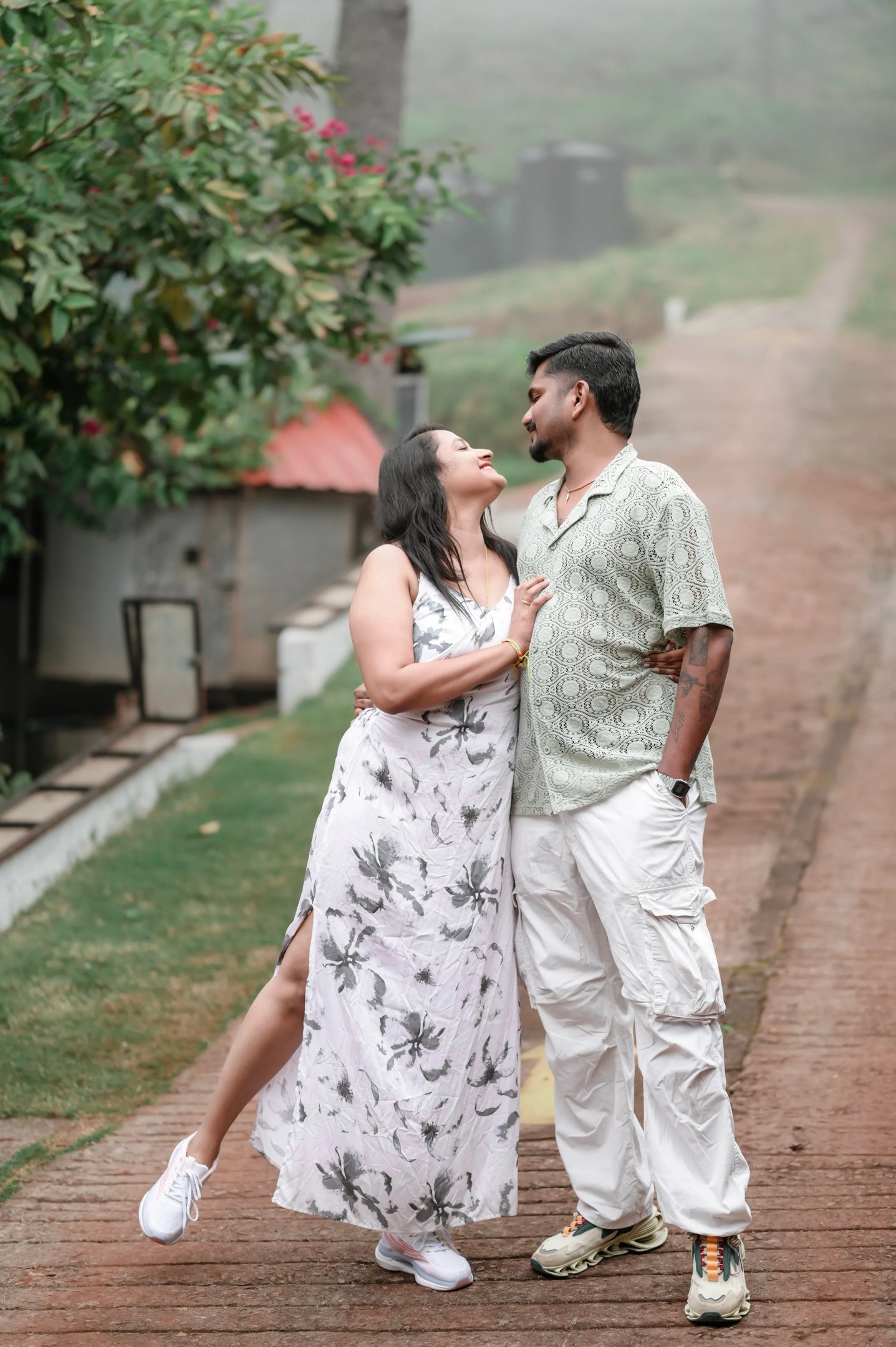 The couple embracing warmly during the cool Ooty weather.