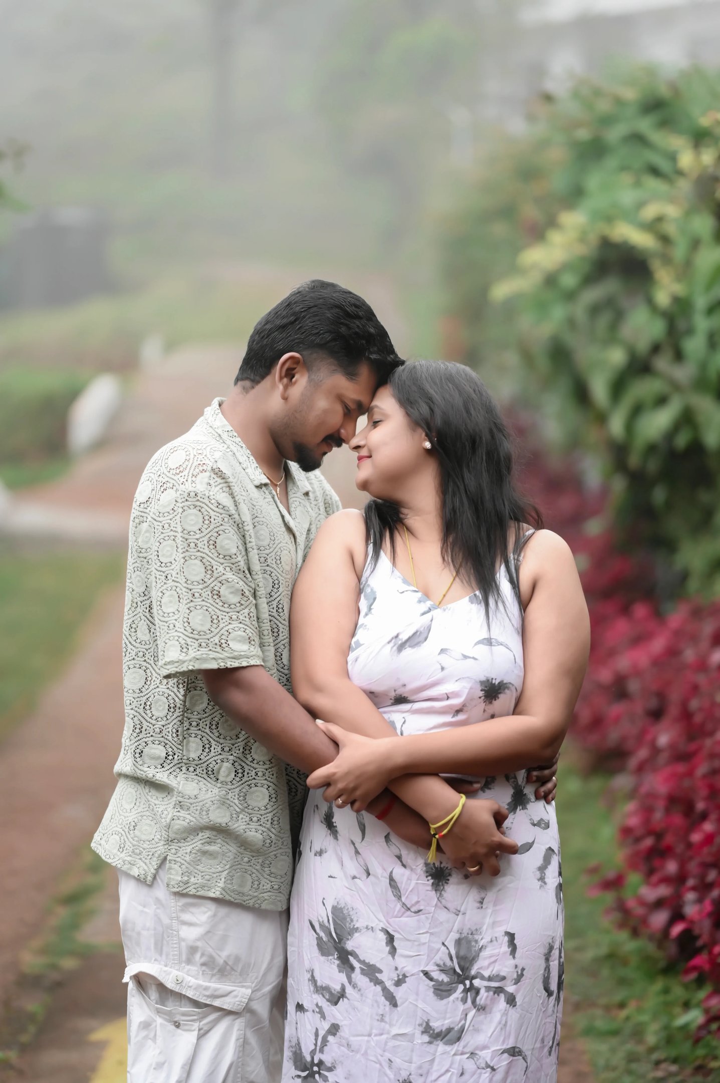 A silhouette of the couple against the dramatic Ooty sky.